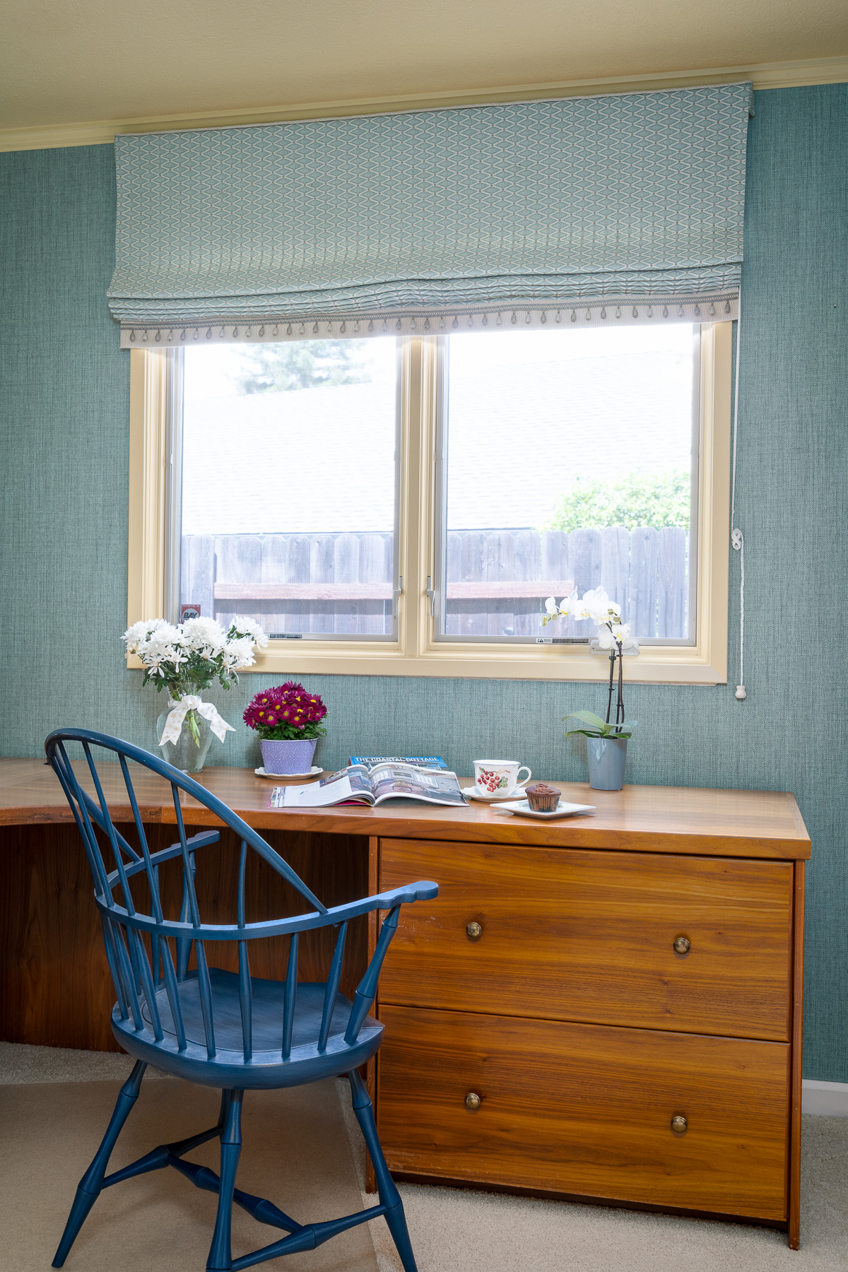 Blue Roman shade in a home office