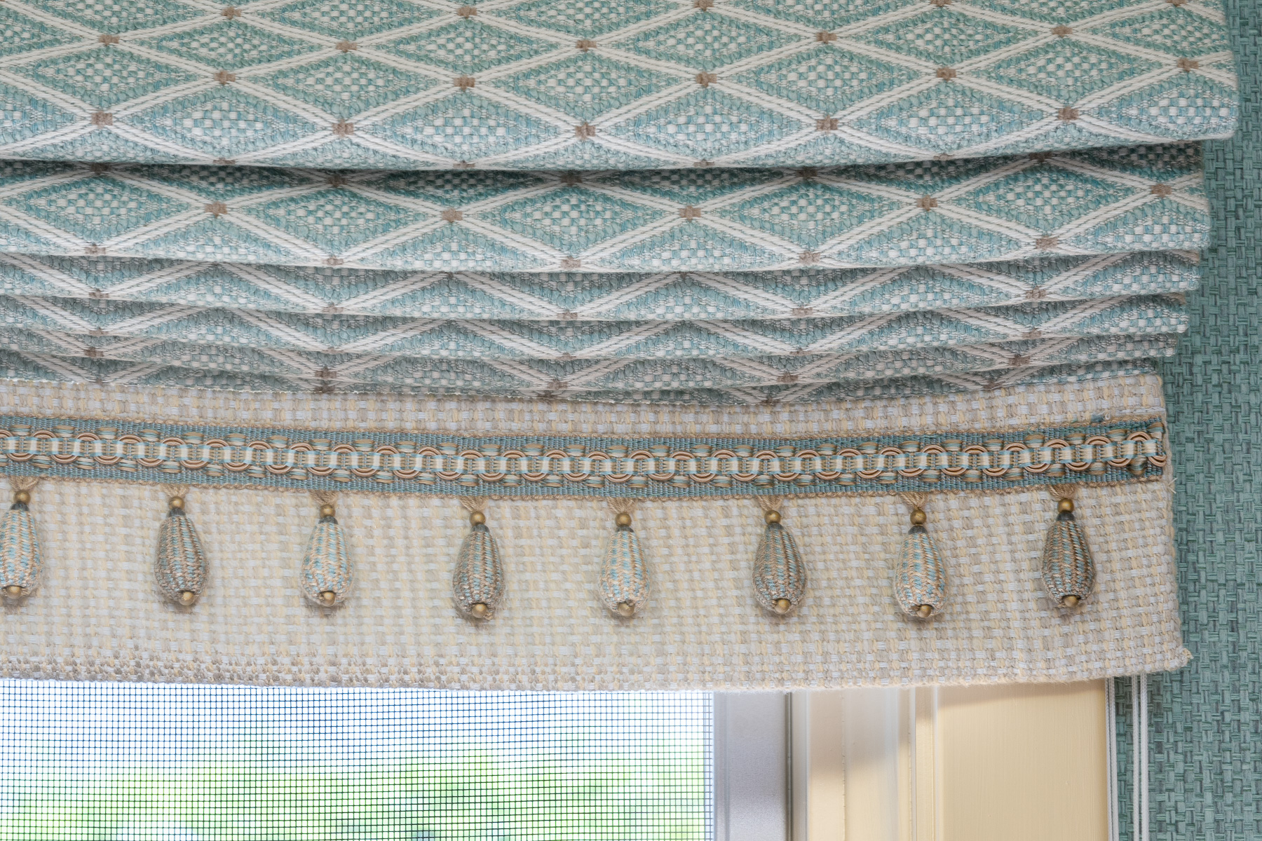 Tassel trim detail on home office Roman shade