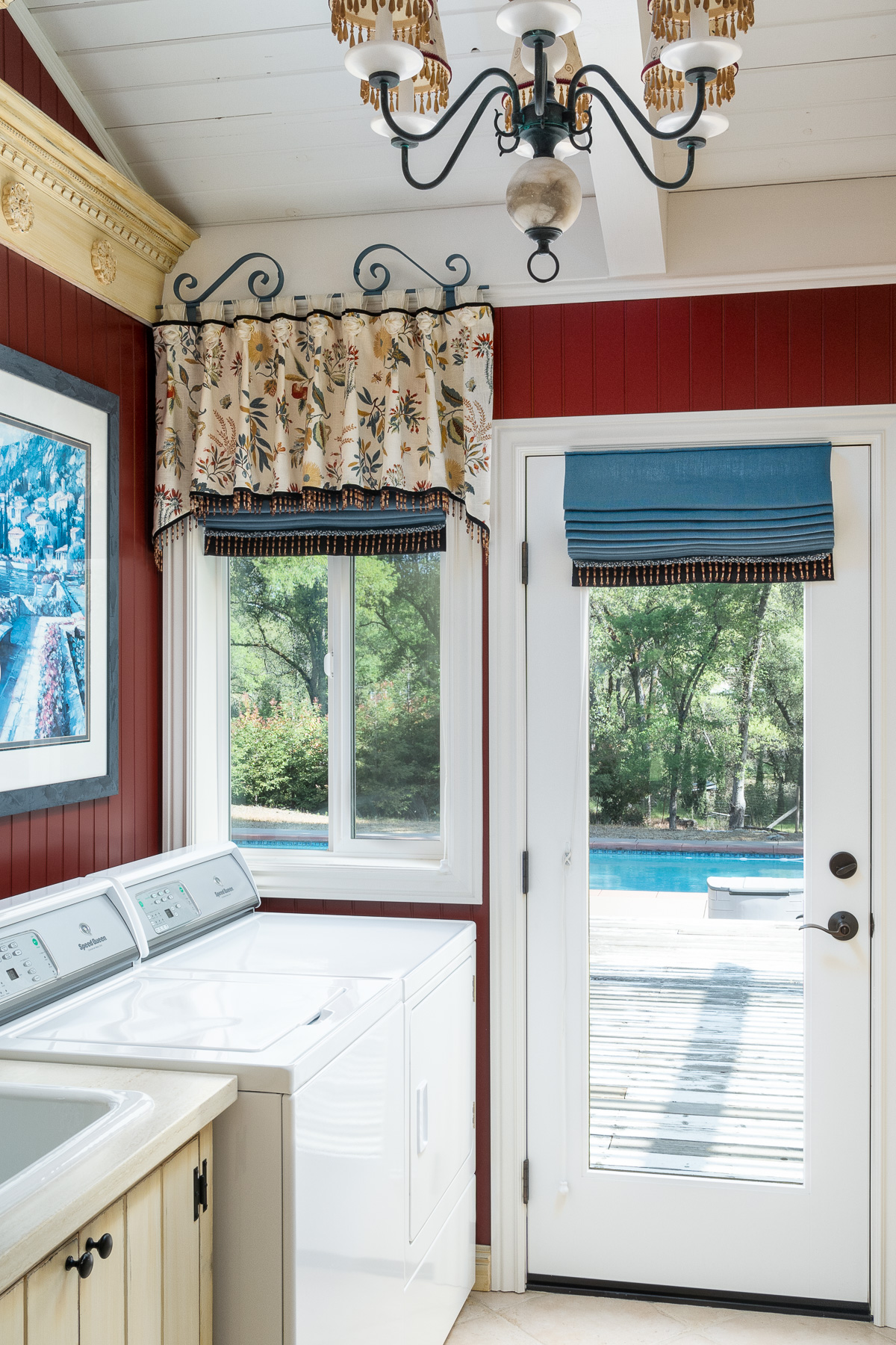 Blue roman shades in laundry room