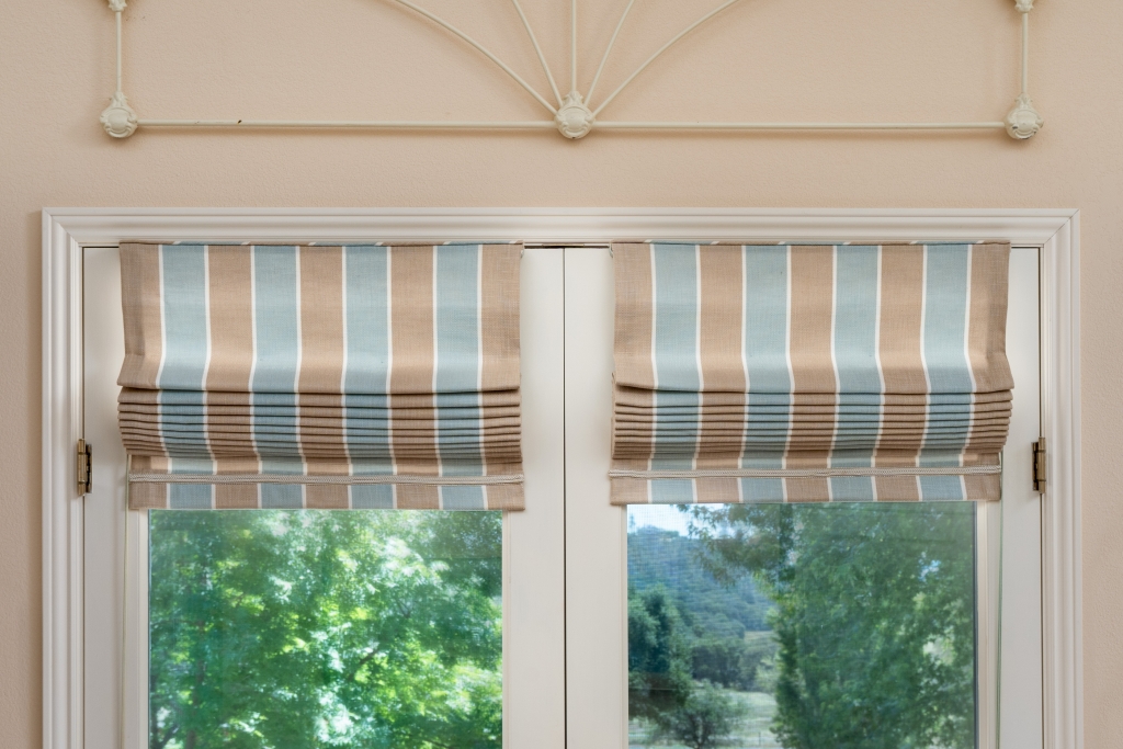 Tan and blue Roman shades on a pair of French doors